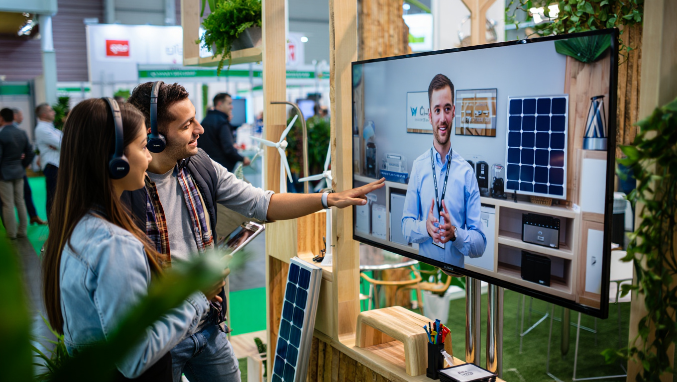 Trade show visitors interacting with Video Window Event for a live remote demonstration